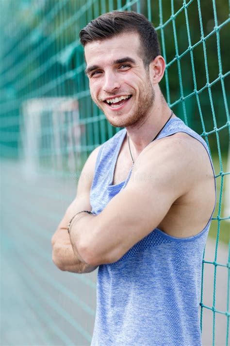 Muscular Naked Guy With A Naked Torso In A Hat Santa Claus Shows Biceps