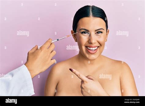 Beautiful Brunette Woman Having Botox Injection Anti Aging Lifting Smiling Happy Pointing With
