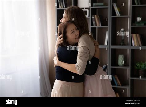 Happy Mature Woman Mother With Grown Up Daughter Hugging Stock Photo Alamy