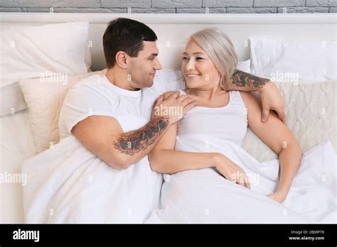 Mature Couple Hugging In Bed Stock Photo Alamy