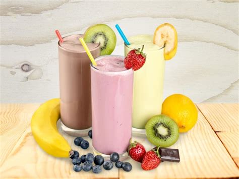 Premium Photo Fruit Smoothies With Straws Isolated On A White Background