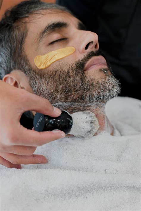 The Clean Cut Man Getting His Beard Groomed - Photos by Canva