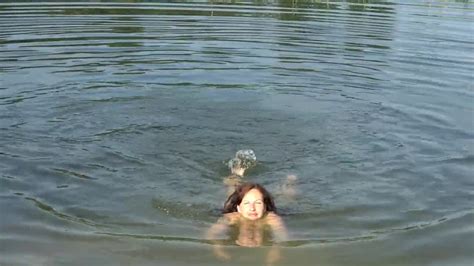 Brunette Swimming Sans Panties And Hooter Sling Hotntubes