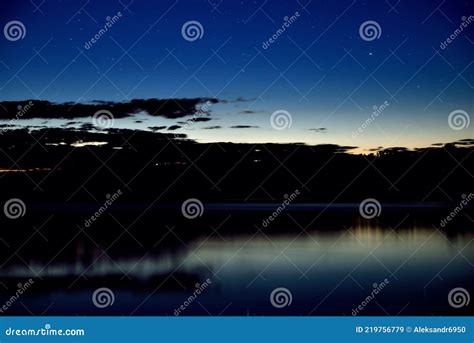 night river night sky  stars reflection  water stock image