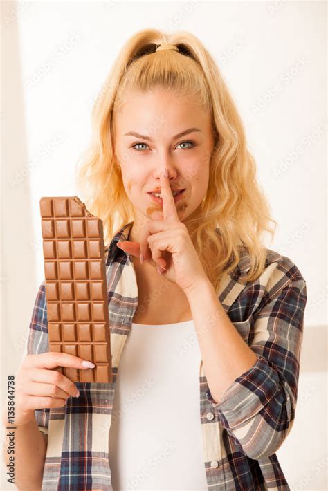 Beautiful Blonde Woman Eats A Big Chocolate Stock Photo Adobe Stock
