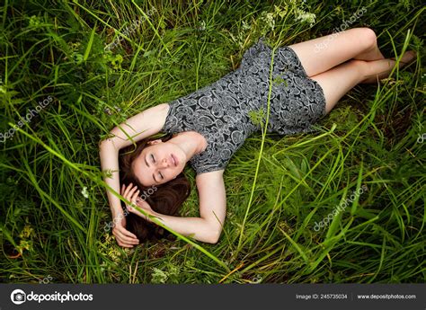 Brunette Woman Lying Green Grass Beauty Girl Outdoors Enjoying Nature Stock Photo By Luljo