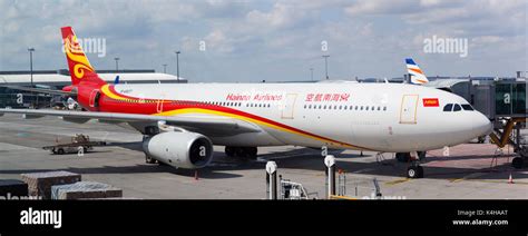 Hainan Airlines airplane parked in Prague airport terminal ...