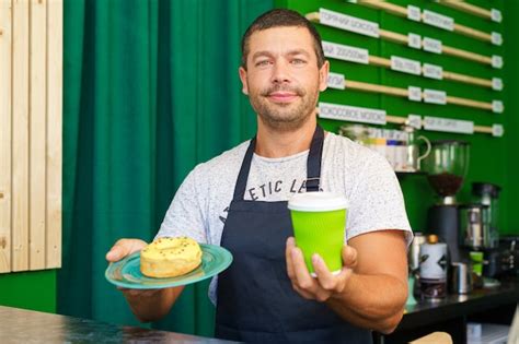 Premium Photo Man Barista In A Coffee Shop Portrait