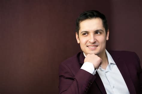 Premium Photo Handsome Brunette Man Sitting On The Sofa