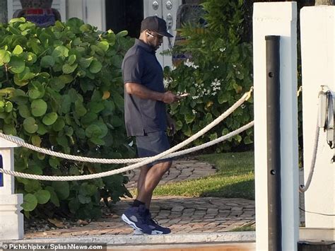 Diddy Takes A Call At His Miami Mansion After Double Raids On His Homes Amid Sex Trafficking