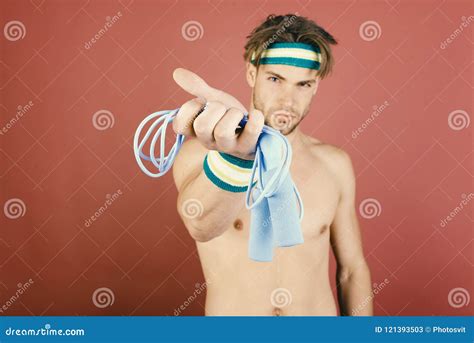 Man With Naked Torso Holds Jump Rope On Pink Background Stock Image Image Of Healthy Bristle
