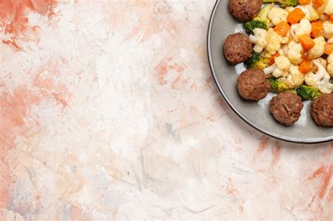 Free Photo Top View Broccoli And Cauliflower Salad And Meatball On Plate On Nude Isolated