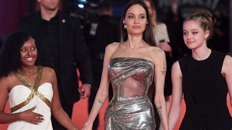 Angelina Jolie In A Silver Bodycon Dress With Zahara Jolie Pitt And