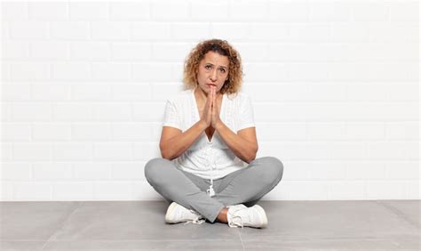 Premium Photo Middle Age Woman Feeling Worried Hopeful And Religious