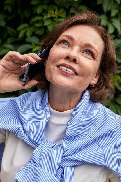 Premium Photo Attractive Senior Woman Talking On The Phone Mature Caucasian Lady Uses