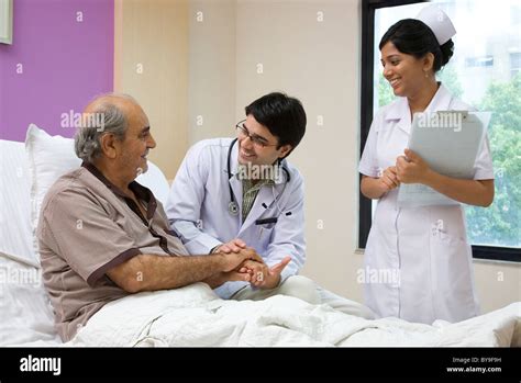 Doctor Talking To His Patient Stock Photo Alamy