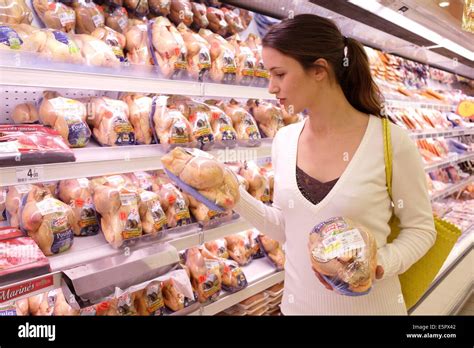Woman Shopping In The Poultry Section In Supermarket Stock Photo Alamy