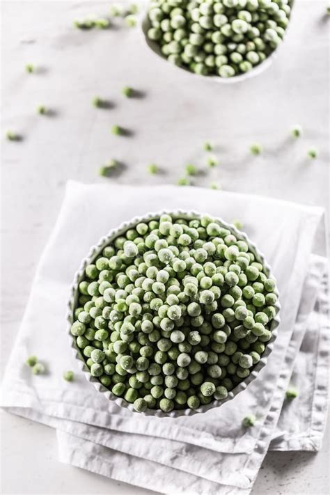 frozen peas   white porcelain bowl stock photo image  freshness