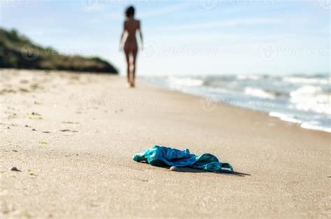 Swimsuit In The Sand On The Beach And Naked Female Figure 17521809 Stock Photo At Vecteezy