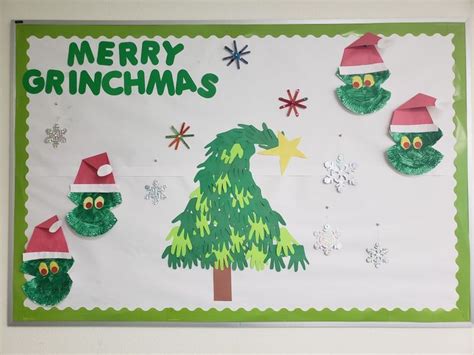 a christmas bulletin board with green and red decorations