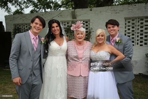 Linda Birgitte Olsen poses with her sons Adam Olsen and Noah Olsen