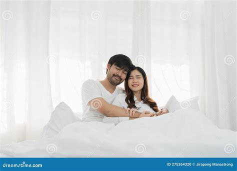 Asian Romantic Couple In Bed Enjoying Sensual Foreplay Happy Sensual Young Couple Lying In Bed