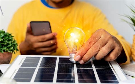 Premium Photo Energy Engineers People Holding Light Bulbs While