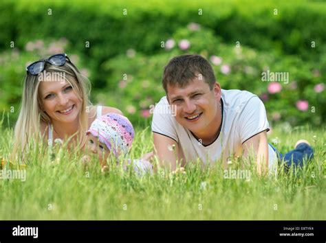 Portrait Of Happy Family In Garden Stock Photo - Alamy