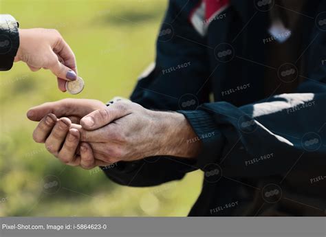 Man Giving Money To Homeless