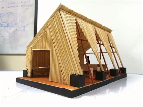 A Model Of A House Made Out Of Wood