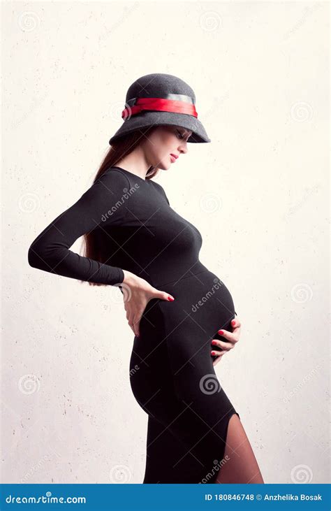 Pregnant Girl Dressed In Black Dress And Hat Stock Photo Image Of