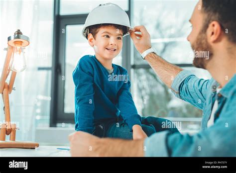 Joyful Brunette Kid Looking At His Father Stock Photo Alamy