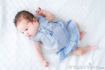 Adorable Tiny Newborn Baby Girl In A Blue Dress Stock Photo ...