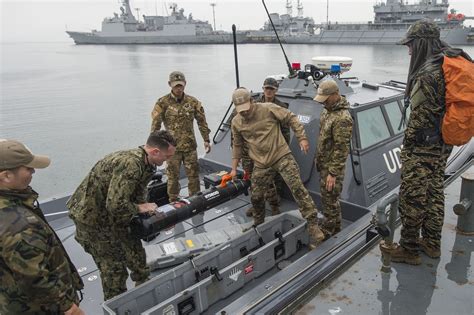 South Korean Udtseal And Us Navy Sailor Handling A Mk 18 Mod 1 Unmanned