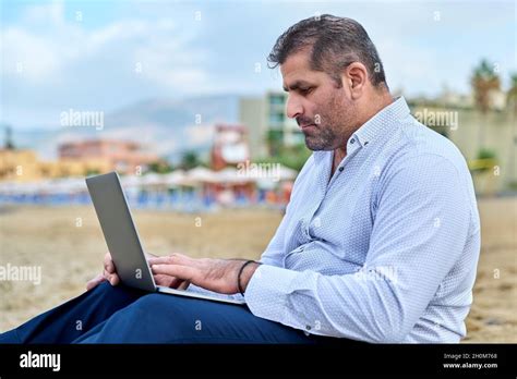 Serious Confident Mature Man With Laptop Outdoors Stock Photo Alamy