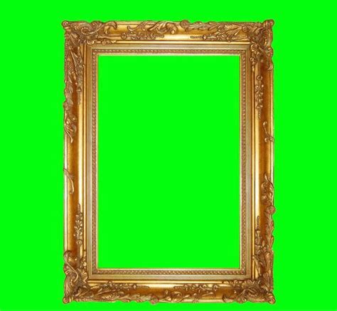 An Ornate Gold Frame On A Green Background With Clippings To The Left