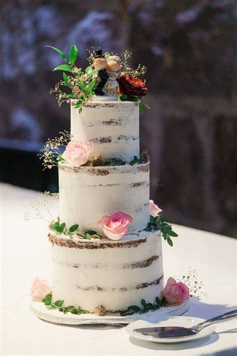 Wedding Naked Cake Decorated With Flowers And Greenery On A Cake Stock Image Image Of