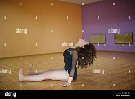 Curly Brunette Plus Size Model Doing Acrobatic At Dance Room Stock
