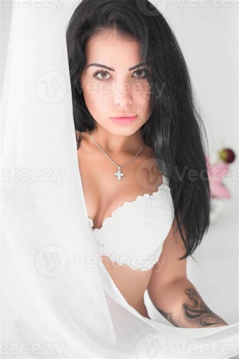 Beautiful Brunette Posing In Studio Stock Photo At Vecteezy