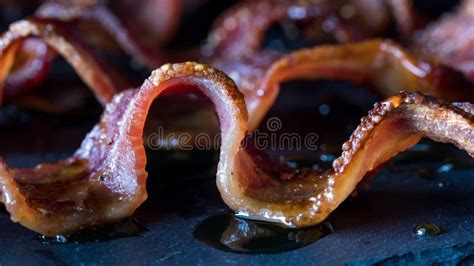 Close Up Of A Wavy Strip Of Maple Pepper Bacon Hot Off The Griddle Stock Image Image Of