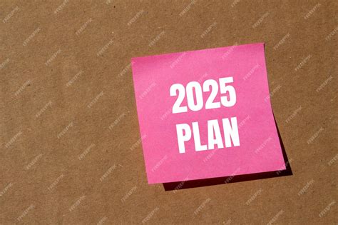 Premium Photo 2025 Plan Message Written On Pink Paper With Cardboard