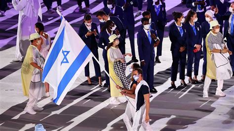 Olympics-Superstar Osaka lights flame as Japan's COVID-hit Games open