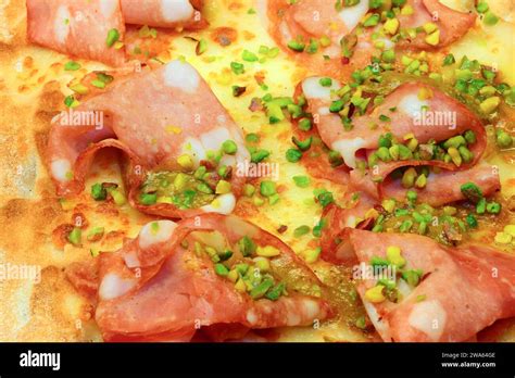 Focaccia Called PINSA In Italian With Mortadella And Pistachio Grains