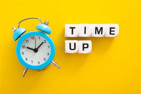 Premium Photo Time Up Word With Clock On Yellow Background