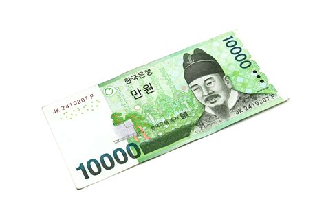 isolated white background featuring korean won currency bills photo