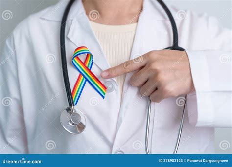 Doctor With LGBTQ Rainbow Ribbon For Support Lesbian Gay Bisexual Transgender And Community
