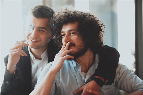 Portrait Of Multiethnic Diverse Gay LGBT Romantic Male Couple Embracing And Showing Their Love