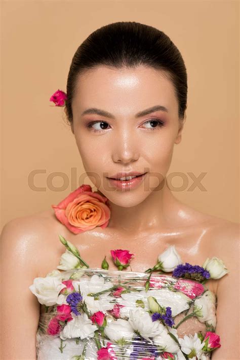 Attractive Naked Asian Girl In Fresh Flowers Isolated On Beige Stock Image Colourbox