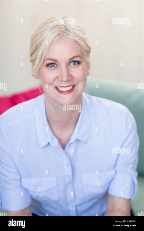 Portrait Mature Woman With Blond Hair And Blue Eyes Stock Photo Alamy