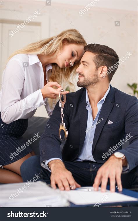 Стоковая фотография 647548618 Young Blonde Secretary Offering Handcuffs Young Shutterstock